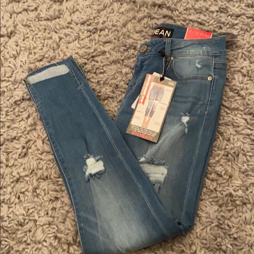 Enjean size 7 distressed light denim jeans.
